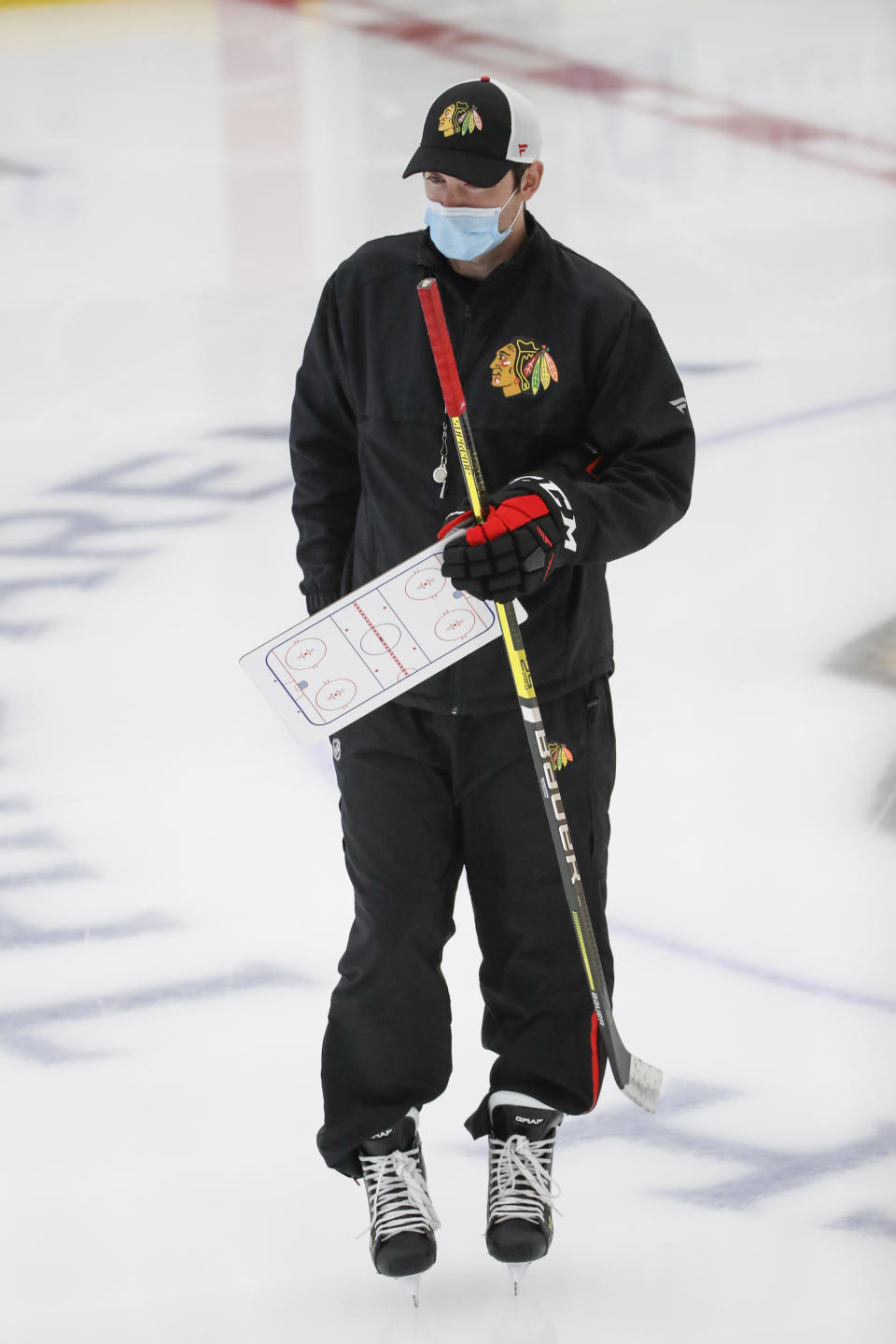Chicago Blackhawks head coach Jeremy Collition takes the ice for NHL hockey practice at Fifth Third Arena on Monday, July 13, 2020, in Chicago. (AP Photo/Kamil Krzaczynski)