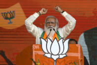 FILE - In this March 7, 2021, file photo, Indian Prime Minister Narendra Modi addresses a public rally ahead of West Bengal state elections in Kolkata, India. As coronavirus deaths mount and a vaccine rollout falters badly, the crisis has badly dented Modi’s carefully cultivated image as an able technocrat. (AP Photo/Bikas Das, File)