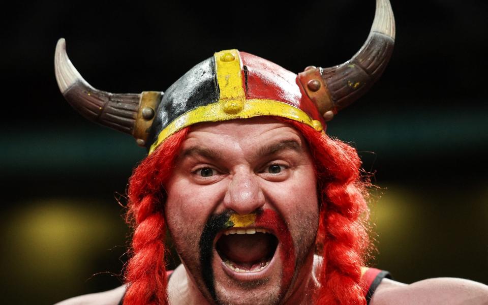 A Belgium fan cheers ahead of kick off during the International friendly football match between England and Belgium