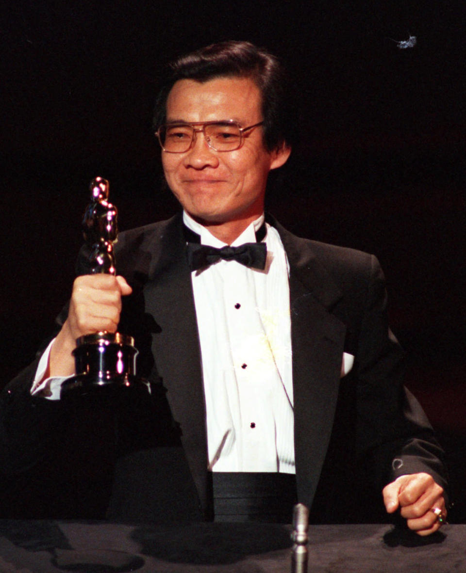 FILE- Haing S. Ngor, accepts the award for best supporting actor Oscar for his role in "The Killing Fields", at the 57th annual Academy Awards in Los Angeles on March 26, 1985. (AP Photo, File)