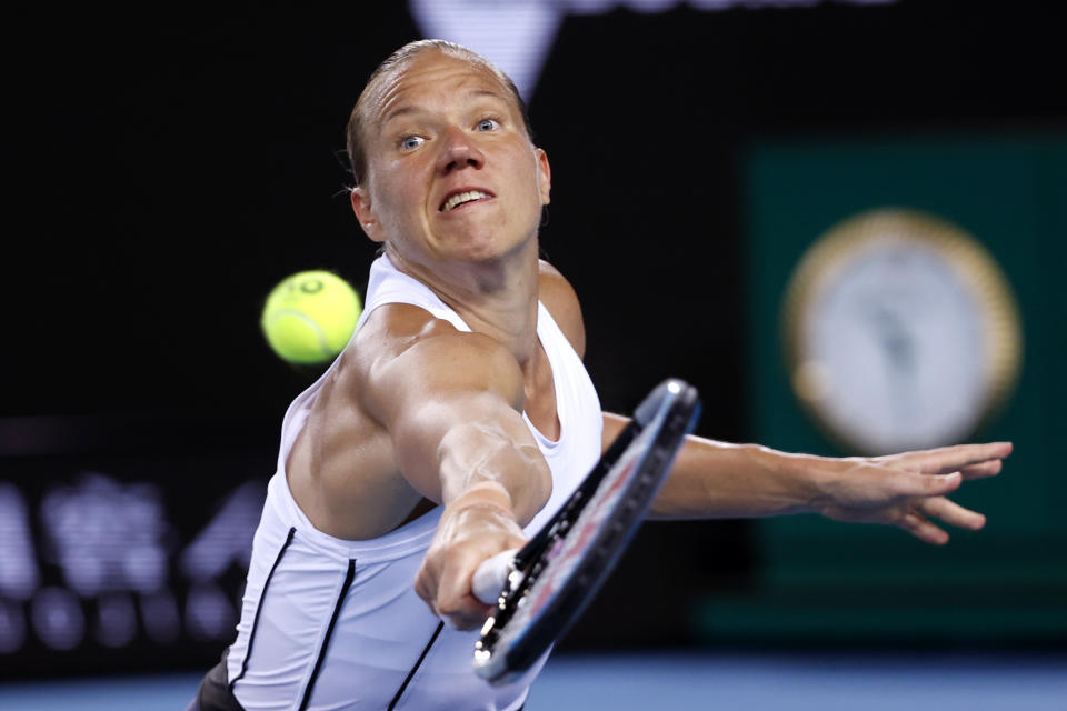 Kaia Kanepi of Estonia makes a backhand return to Aryna Sabalenka of Belarus during their fourth round match at the Australian Open tennis championships in Melbourne, Australia, Monday, Jan. 24, 2022. (AP Photo/Hamish Blair)