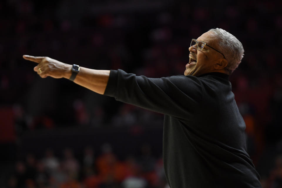 Kansas City's coach Marvin Menzies points during the first half of an NCAA college basketball game against Illinois Friday, Nov. 11, 2022, in Champaign, Ill. (AP Photo/Michael Allio)