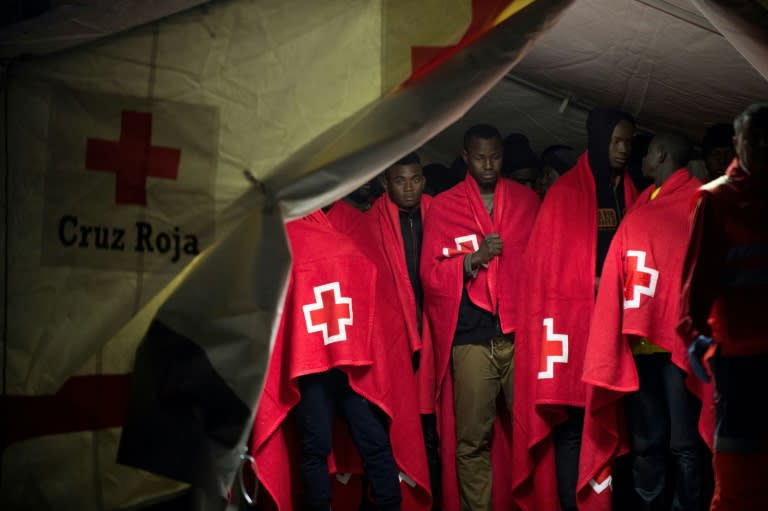 Migrant people in a Red Cross tent on their arrival on a Spanish coast guard vessel at the southern Spanish port of Malaga on February 26, 2017