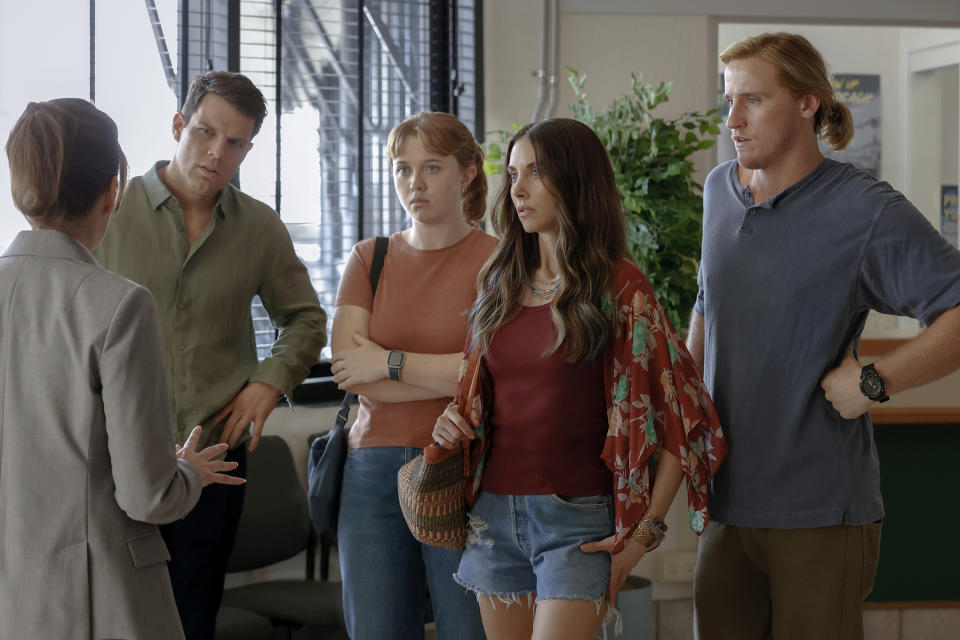 This image released by Peacock shows, from second left, Jake Lacy, Essie Randles, Alison Brie and Conor Merrigan-Turner in a scene from "Apples Never Fall." (Vince Valituttiin/Peacock via AP)