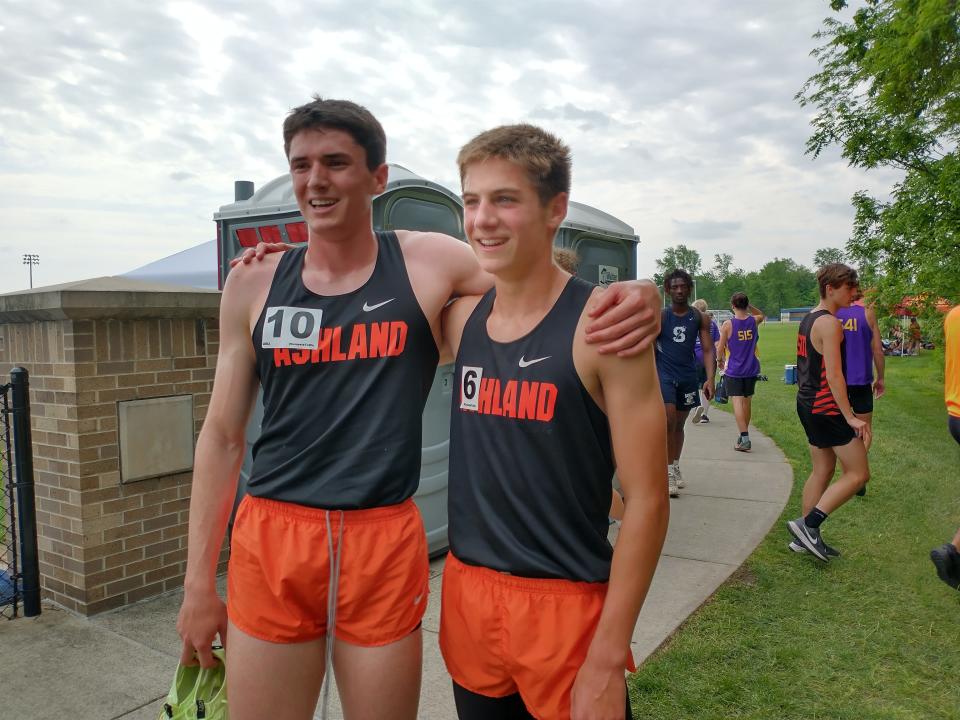 Ashland junior Lukah Will (left) and freshman Tyler Sauder celebrate their one-two finish in the 800 meter run.