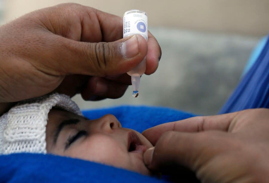 An Afghan child is vaccinated against polio during a polio eradication campaign in Jalalabad, Nangarhar province, east of Kabul, Afghanistan, Monday, Oct. 12, 2009. Around 7.7 million Afghan children are going to be vaccinated in a three days of a polio vaccination drive, launched by Afghan Health Ministry with the cooperation of the World Health Organization and the United Nations Children’s Fund in the country. (AP Photo/Rahmat Gul)