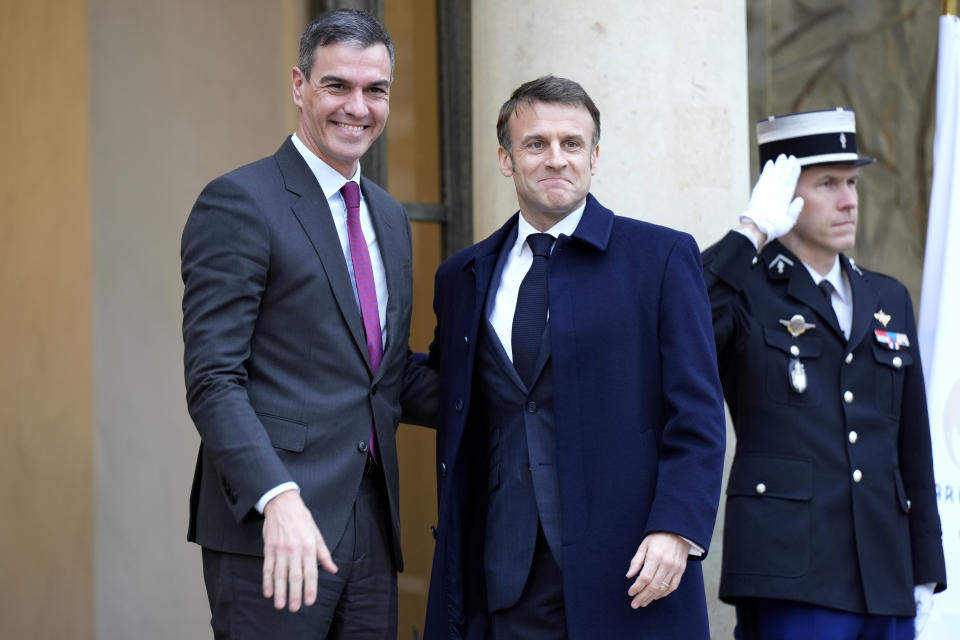 French President Emmanuel Macron, right, welcomes Spanish Prime Minister Pedro Sanchez at the Elysee Palace in Paris, Monday, Feb. 26, 2024. More than 20 European heads of state and government and other Western officials are gathering in a show of unity for Ukraine, signaling to Russia that their support for Kyiv isn't wavering as the full-scale invasion grinds into a third year. (AP Photo/Lewis Joly)