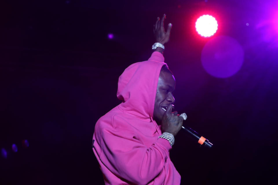 DaBaby performs with former NBA basketball player Shaquille O' Neal at Shaq's Fun House, Saturday, Feb. 1, 2020, in Miami. This carnival themed music festival is one of numerous events taking place in advance of Miami hosting Super Bowl LIV on Feb. 2. (AP Photo/Lynne Sladky)