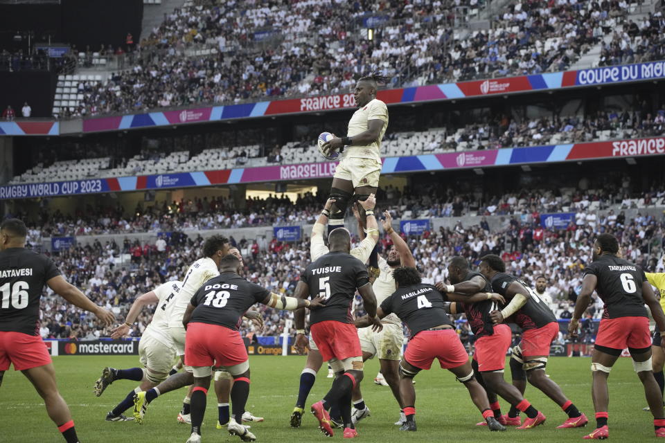 England's Maro Itoje catches the ball during the Rugby World Cup quarterfinal match between England and Fiji at the Stade de Marseille in Marseille, France, Sunday, Oct. 15, 2023. (AP Photo/Laurent Cipriani)