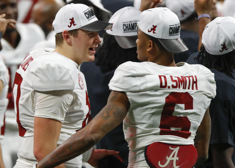 ATLANTA, GA - DECEMBER 19: Quarterback Mac Jones #10 celebrates the victory with wide receiver DeVonta Smith #6 of the Alabama Crimson Tide at the conclusion of the game against the Florida Gators during the SEC Championship game at Mercedes-Benz Stadium on December 19, 2020 in Atlanta, Georgia. (Photo by Todd Kirkland/Getty Images)