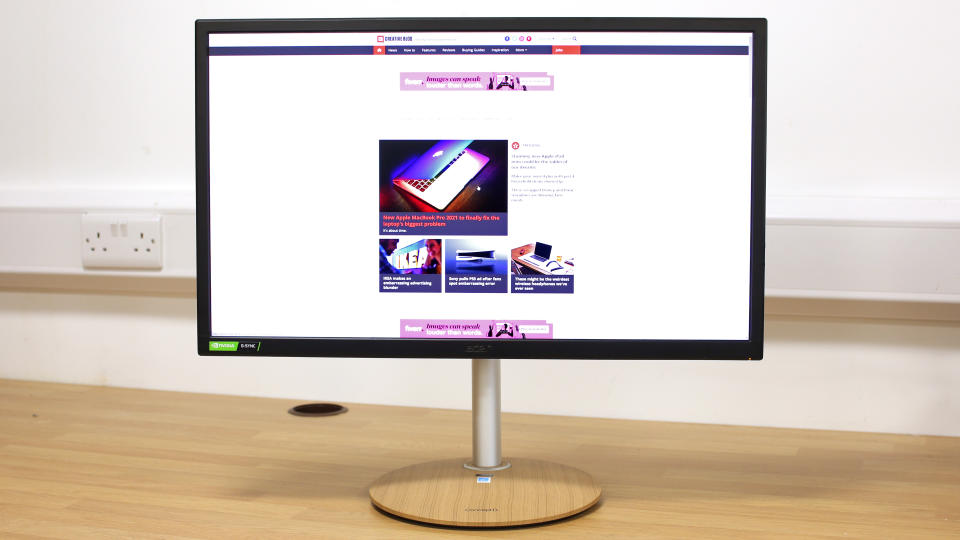 Product shot of the Acer ConceptD CP3271K, one of the best monitors for video editing, on a wooden desk