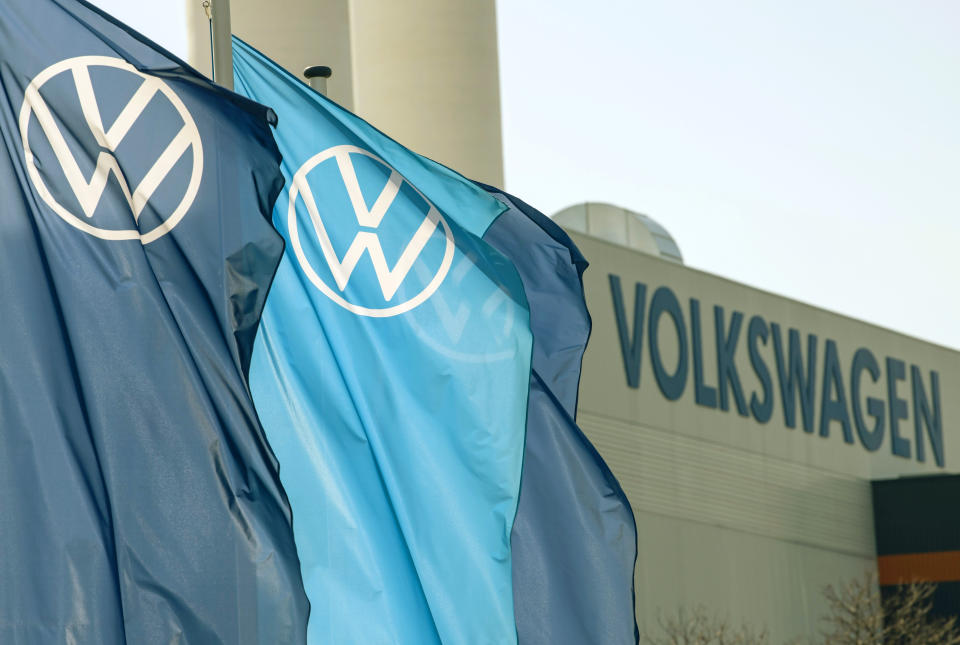 FILE - Company logo flags wave in front of a Volkswagen factory building in Zwickau, Germany, on April 23, 2020. European governments are contemplating new sanctions against Russia if it invades Ukraine – and it’s going to be complicated. Sanctions would aim to maximize the pain for the Kremlin, its key banks and energy companies but also avoid jeopardizing the continent’s Russian-dependent energy supplies or inflicting too much damage on European companies with strong ties to Russia. (AP Photo/Jens Meyer, File)