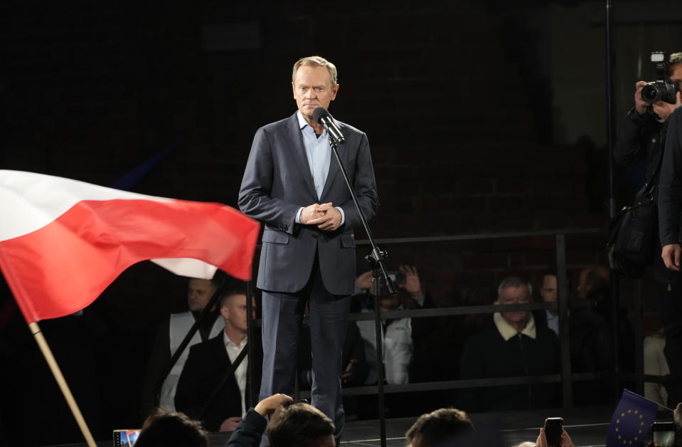 Former Polish Prime Minister Donald Tusk prepares to speak from the podium during a demonstration in support of Poland's EU membership in Warsaw, Poland, Sunday, October 10, 2021. Poland's constitutional court ruled Thursday that Polish laws have supremacy over those of the European Union in areas where they clash, a decision likely to embolden the country's right-wing government and worsen its already troubled relationship with the EU. (AP Photo/Czarek Sokolowski)