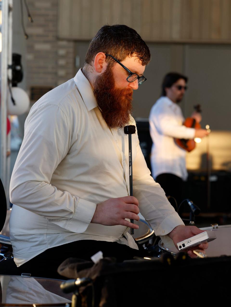 Jamie Whitmarsh tunes his tympani drums July 3 before the start of the annual Oklahoma City Philharmonic outdoor Independence Day concert "Red, White & Boom!" at Scissortail Park in downtown Oklahoma City.