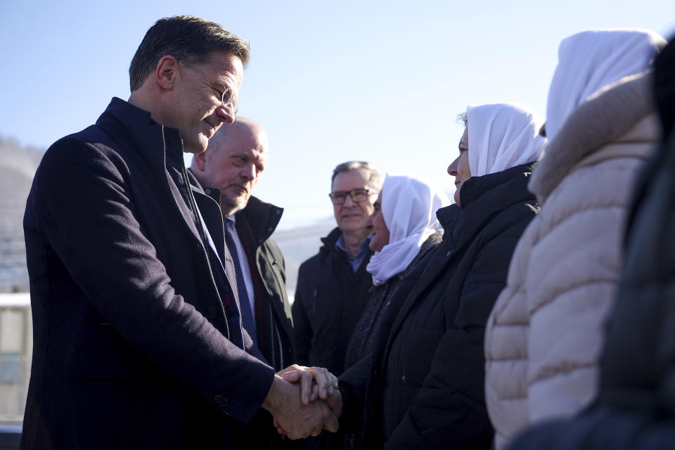 Prime Minister of the Netherlands, Mark Rutte, left, shakes hands with members of Mothers of Srebrenica association, at the Srebrenica Memorial Center in Potocari, Bosnia, Monday, Jan. 22, 2024. (AP Photo/Armin Durgut)