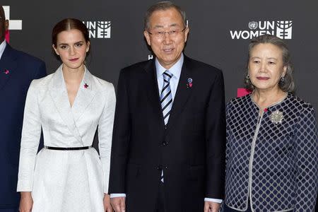 Actress Emma Watson (L), United Nations Secretary General Ban Ki-moon and his wife Yoo Soon-taek pose for a photo during a photo opportunity promoting the HeForShe campaign in New York September 20, 2014. REUTERS/Carlo Allegri