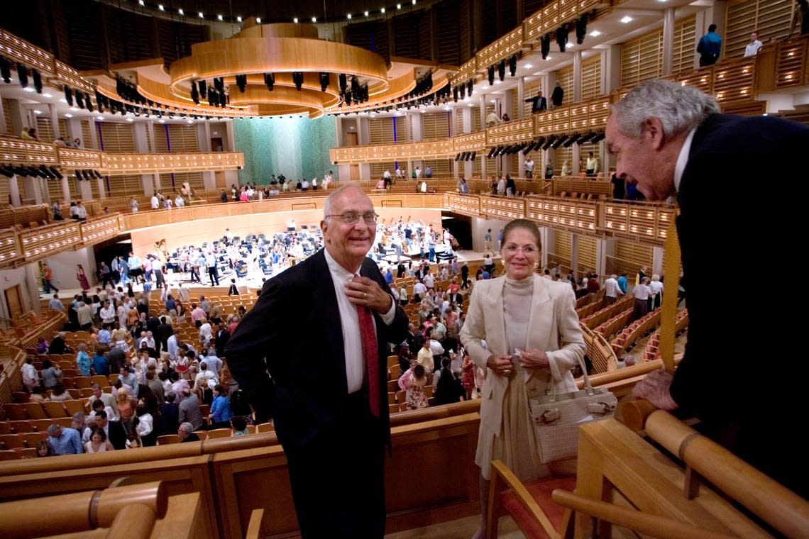 Parker D. Thomson, left, former Chairman of the Carnival Center for the Performing Arts Trust Board of Directors (now the Adrienne Arsht Center for the Performing Arts), and fellow board member Judy Weiser, center, accepting congratulations from Russell Johnson, right, acoustician from Artec Inc., who was overseeing the hall’s tuning in 2006.