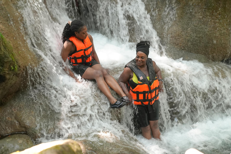 Isabel and Eugenie have great fun on Race Across The World at the waterfalls.