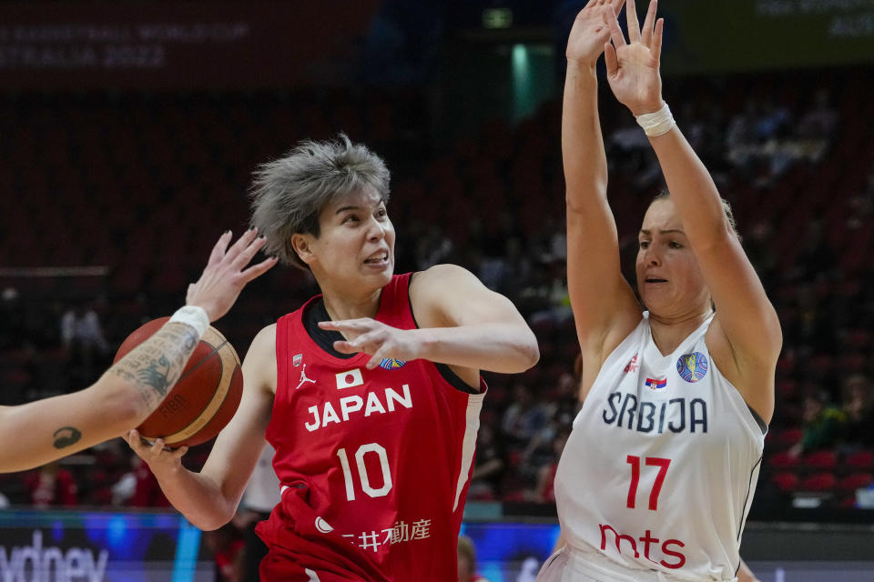 Japan's Ramu Tokashiki, left, lays up for a shot at goal as Serbia's Jovana Nogic attempts to block during their game at the women's Basketball World Cup in Sydney, Australia, Friday, Sept. 23, 2022. (AP Photo/Mark Baker)