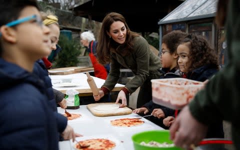 Catherine, Duchess of Cambridge speaks with children and helps makes pizza as she visits Islington Community Garden on January 15, 2019 in London, England.  - Credit: WPA pool