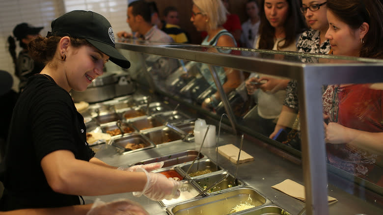 Chipotle employee taking order