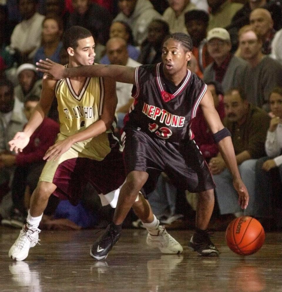 St. Anthony guard Donald Copeland defends Neptune's Terrance Todd, in the 2001 Holiday Jubilee final at Neptune High School.