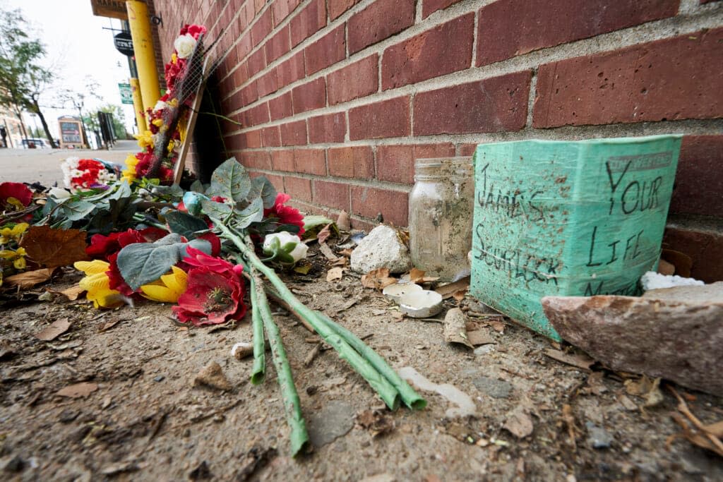 A memorial for James Scurlock remains Wednesday, Sept. 16, 2020, near where he was shot and killed on May 30, in Omaha, Neb. A federal judge has thrown out a lawsuit filed by the family of a white Nebraska bar owner who killed himself after being charged in the fatal shooting of Scurlock. ( AP Photo/Nati Harnik File)