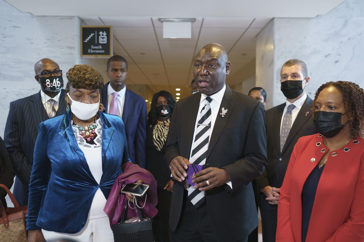 Civil rights attorney Ben Crump, who represented the George Floyd family, is seen with Philonise Floyd (far left), brother of George Floyd, and Gwen Carr (to Crump's immediate right), mother of Eric Garner, and other advocates for police reform. 
