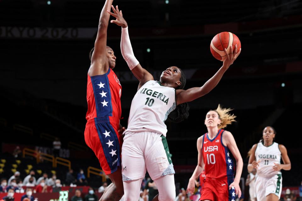 Nigeria's Promise Amukamara goes to the basket past USA's Jewell Loyd (L) in the women's preliminary round group B basketball match between Nigeria and USA during the Tokyo 2020 Olympic Games at the Saitama Super Arena in Saitama on July 27, 2021. (Photo by Thomas COEX / AFP) (Photo by THOMAS COEX/AFP via Getty Images)