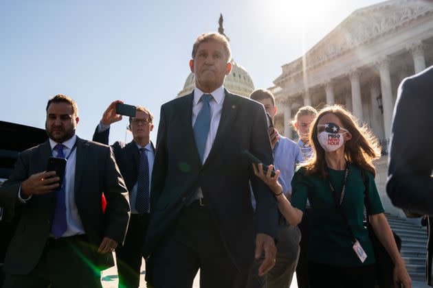 Sen. Joe Manchin (D-W.Va.) is surrounded by reporters after he exits the Senate side of the U.S. Capitol on Wednesday. (Photo: Kent Nishimura via Getty Images)