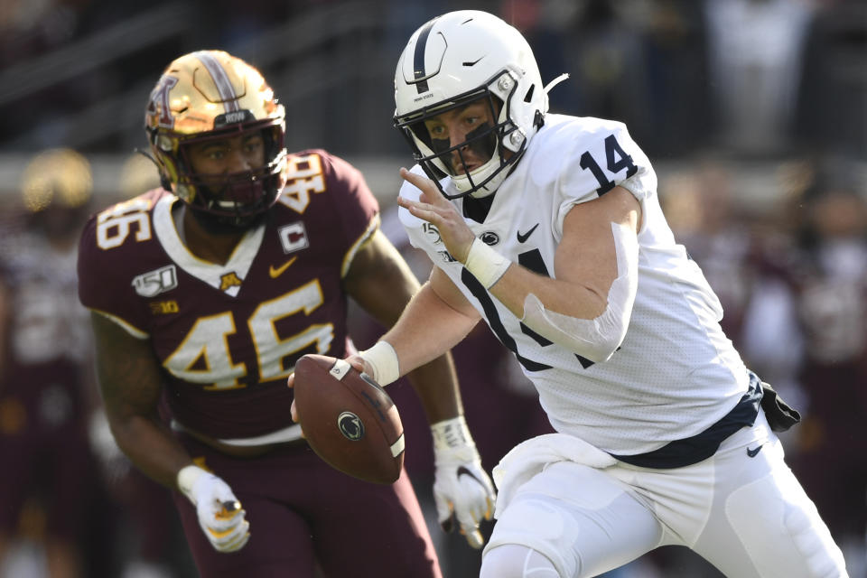 Penn State quarterback Sean Clifford (14) runs against the Minnesota Golden Gophers on Nov. 9, 2019. (Hannah Foslien/Getty Images)