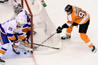 New York Islanders goaltender Semyon Varlamov (40) makes a save on a wraparound attempt by Philadelphia Flyers right wing Jakub Voracek (93) as Islanders' Devon Toews (25) looks on during the first period of an NHL Stanley Cup Eastern Conference playoff hockey game in Toronto, Ontario, Tuesday, Sept. 1, 2020. (Frank Gunn/The Canadian Press via AP)