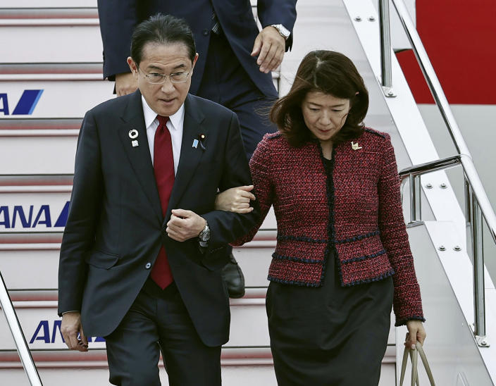 Japanese Prime Minister Fumio Kishida, left, and his wife Yuko arrive at Hiroshima airport for the G-7 summit in Hiroshima, western Japan, Thursday, May 18, 2023. (Kyodo News via AP)