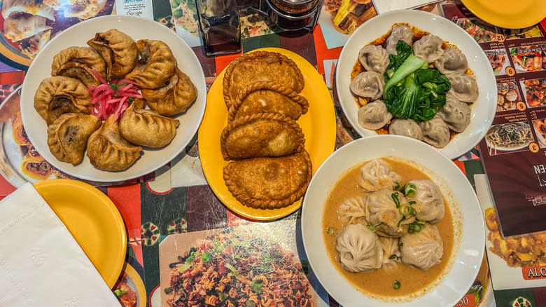 Multiple plates of momos at Lhasa Liang Fen