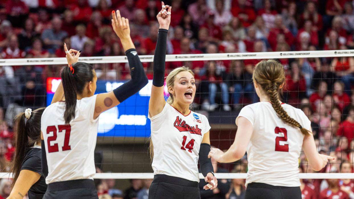 Nebraska's Lexi Rodriguez, Harper Murray, Ally Batenhorst and Bergen Reilly celebrate a point against Arkansas during their match on Dec. 9. The Cornhuskers will meet Texas for the NCAA championship on Sunday; Nebraska is 2-0 all-time vs. Texas in NCAA title matches.