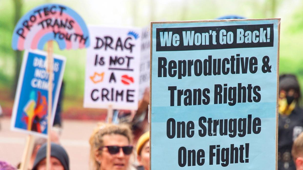 protest signs reproductive transgender rights same fight