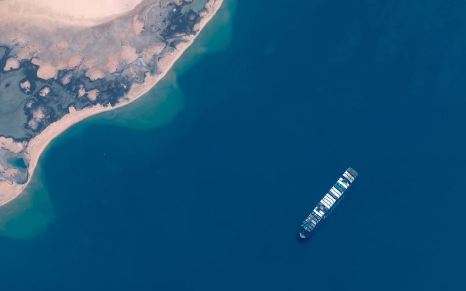 The Ever Given cargo vessel is anchored in the northeastern section of Egypt's Great Bitter Lake - Maxar Technologies