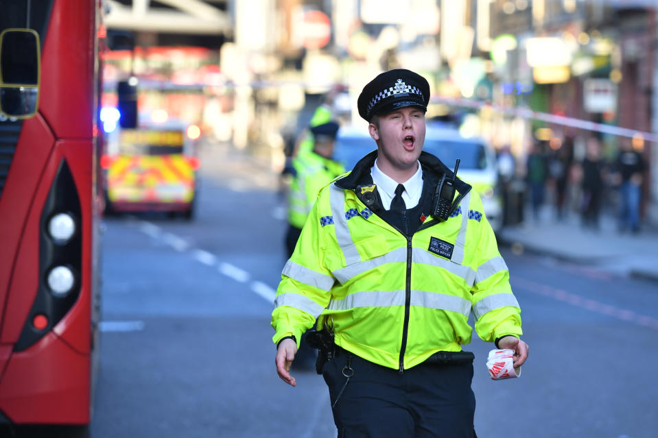 Police instruct members of the public to move away from Borough Market, London.