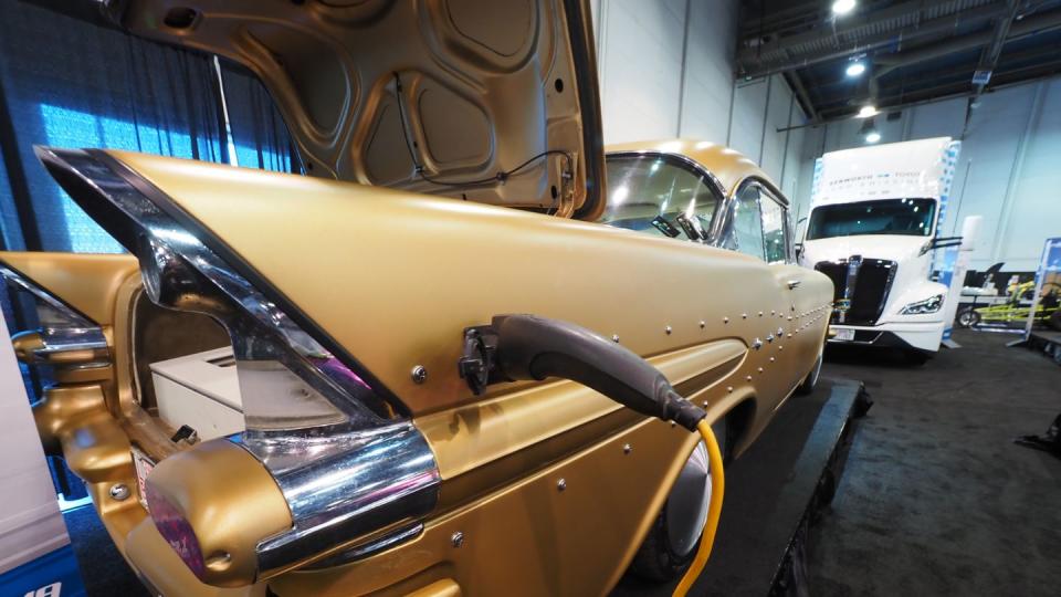 a yellow car on the las vegas convention center floor at sema