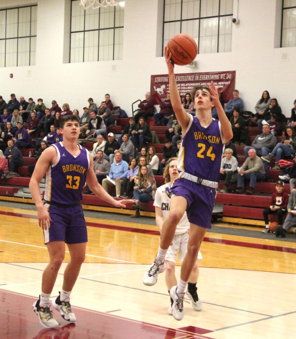 Bronson's Tanner Norton heads in to score two points for the Vikings against Union City on Tuesday.