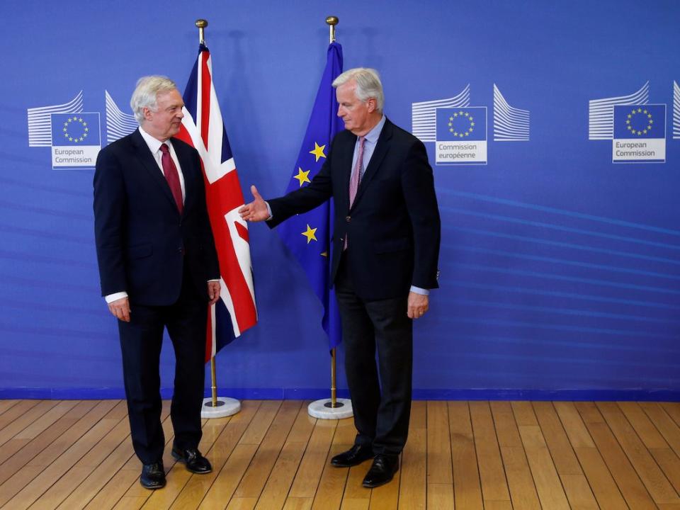 The European Union's chief Brexit negotiator Michael Barnier (R) welcomes Britain's Secretary of State for Exiting the European Union David Davis at the European Commission ahead of their first day of talks in Brussels, June 19, 2017.