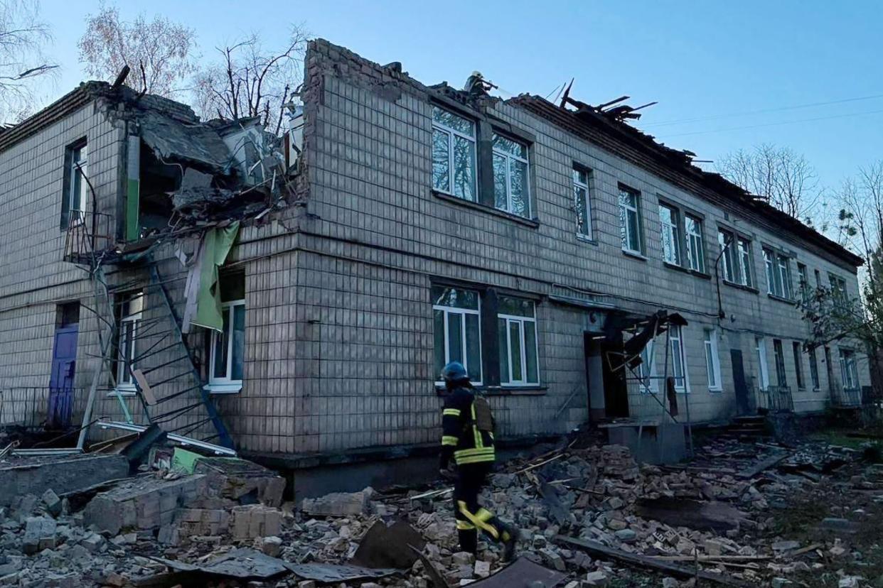 A rescuer working at the site of a drone attack in Kyiv. Ukraine said on November 25, 2023 it had downed 71 Russian attack drones overnight in what Kyiv authorities said was the biggest attack on the capital (UKRAINIAN EMERGENCY SERVICE/AFP)