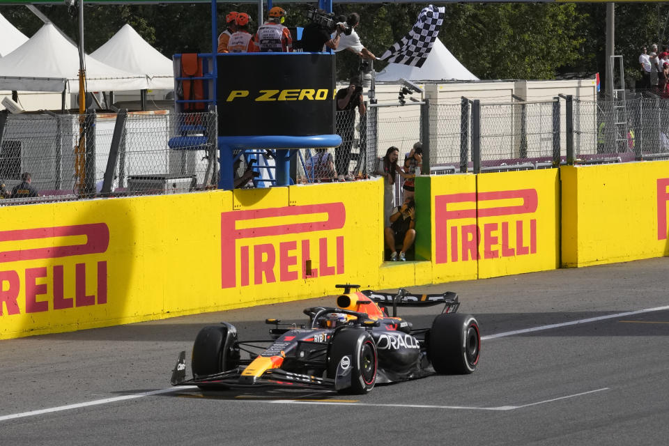 Red Bull driver Max Verstappen of the Netherlands crosses the finish line to win the Formula One Italian Grand Prix auto race, at the Monza racetrack, in Monza, Italy, Sunday, Sept. 3, 2023. (AP Photo/Luca Bruno)