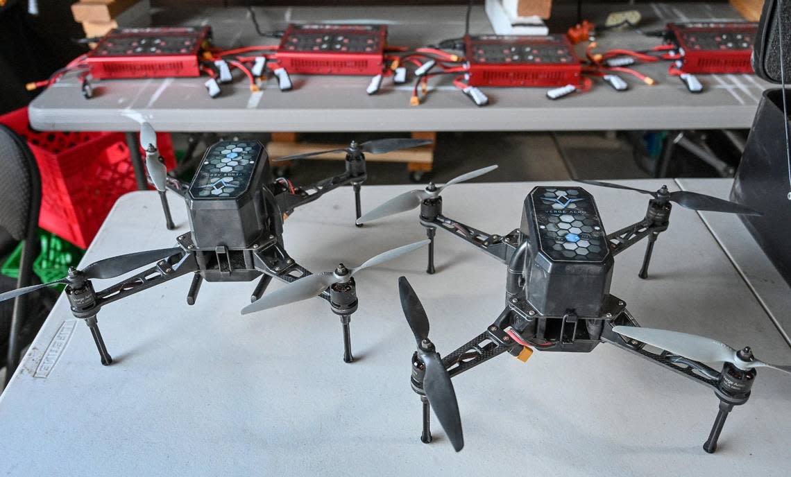 A pair of drones sit in front of battery chargers at the Toews home in Clovis where the husband and wife team owns Skye Dreams which does drone light shows in the area.