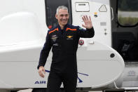 Axiom-3 pilot Walter Villadei, of Italy, waves to family members as he arrives at the Kennedy Space Center Thursday, Jan. 18, 2024, in Cape Canaveral, Fla. Four private astronauts are scheduled to lift off Thursday afternoon to the International Space Station. (AP Photo/Chris O'Meara)