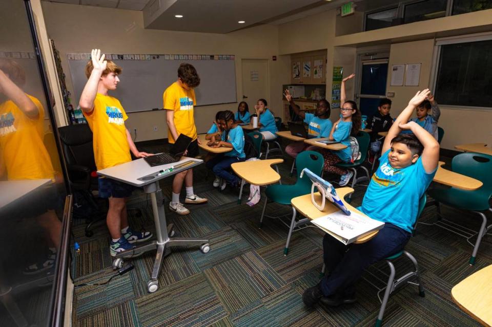 ‘Breakthrough teachers’, Max Feldman, 16, PJ Clingan, 15, give a lesson to students during a Breakthrough Miami, after-school program for middle students held at Ransom Everglades Middle School in Miami, Florida, on Saturday October 14, 2023. Students work with Breakthrough teachers - who often are high school volunteers - on project-based learning activities, such as an environmental science project.