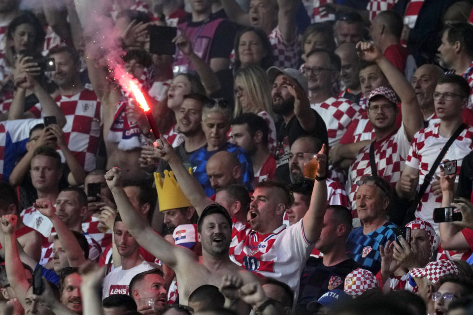 Croatia fans celebrate on the stands during the Nations League semifinal soccer match between the Netherlands and Croatia at De Kuip stadium in Rotterdam, Netherlands, Wednesday, June 14, 2023. (AP Photo/Peter Dejong)