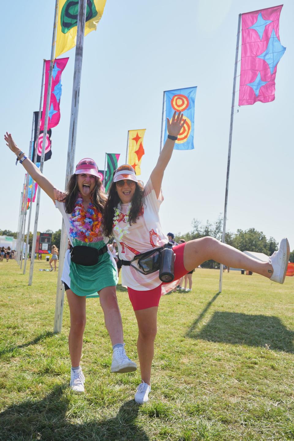 Nicole Somma, right, and Grace Pace, left pose for a portrait Saturday at Austin City Limits Music Festival. The "flag field" is still a popular area to hang out and take photos.