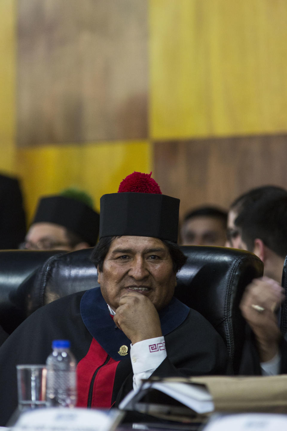 Bolivia's president Evo Morales looks at the camera after he was awarded a Honorary Doctorate at the University of Guatemala, Thursday, Nov. 15, 2018. Morales is in Guatemala for the XXVI Iberoamerican Summit that is taking place in Antigua. (AP Photo/Oliver de Ros)