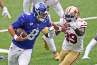 New York Giants quarterback Daniel Jones (8) tries to keep San Francisco 49ers' Jaquiski Tartt away during the second half of an NFL football game, Sunday, Sept. 27, 2020, in East Rutherford, N.J. (AP Photo/Corey Sipkin)